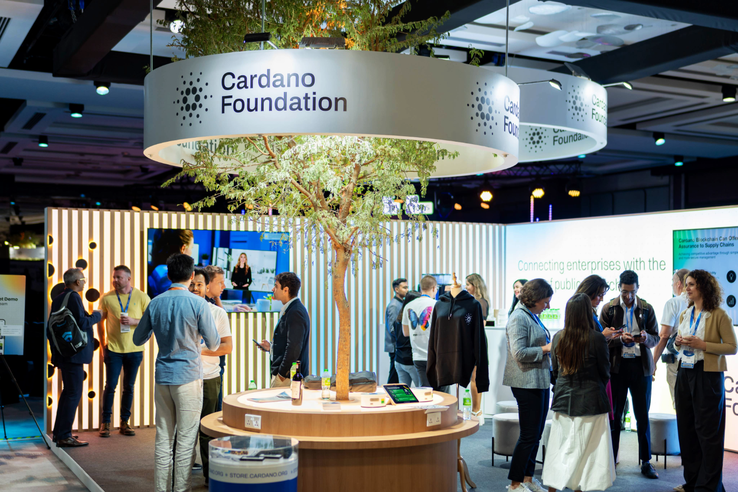 Bespoke exhibition stand with lighting and digital displays creating immersive brand experience by creative event agency